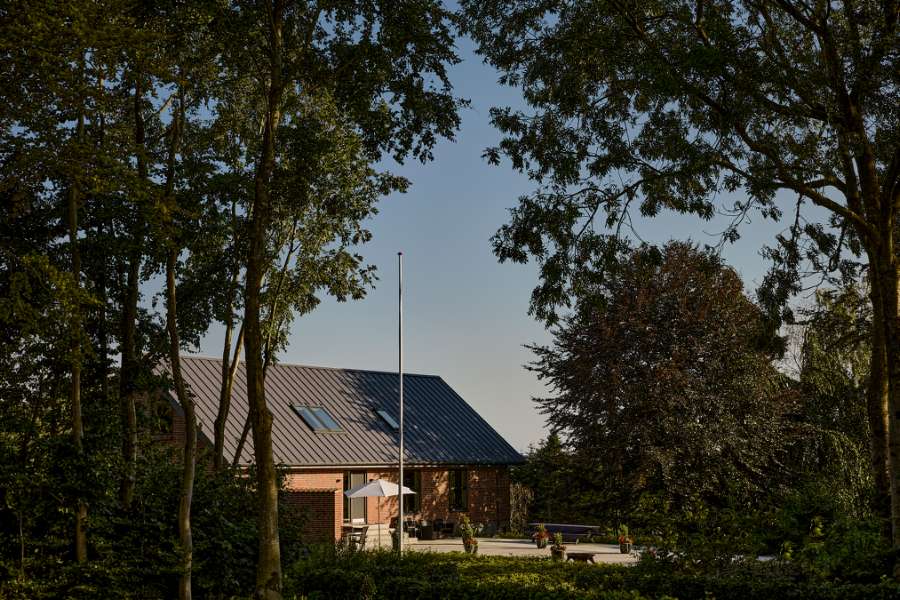 Summer light settles over steel profiles in the forest, Klæstruplundvej 11, 9240 Nibe, Denmark